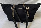 Black Calvin Klein handbag with gold hardware